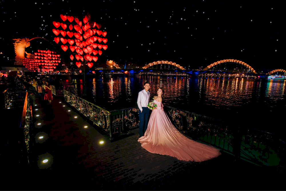 Lots of Vietnamese couples take wedding photos at the Love Lock Bridge